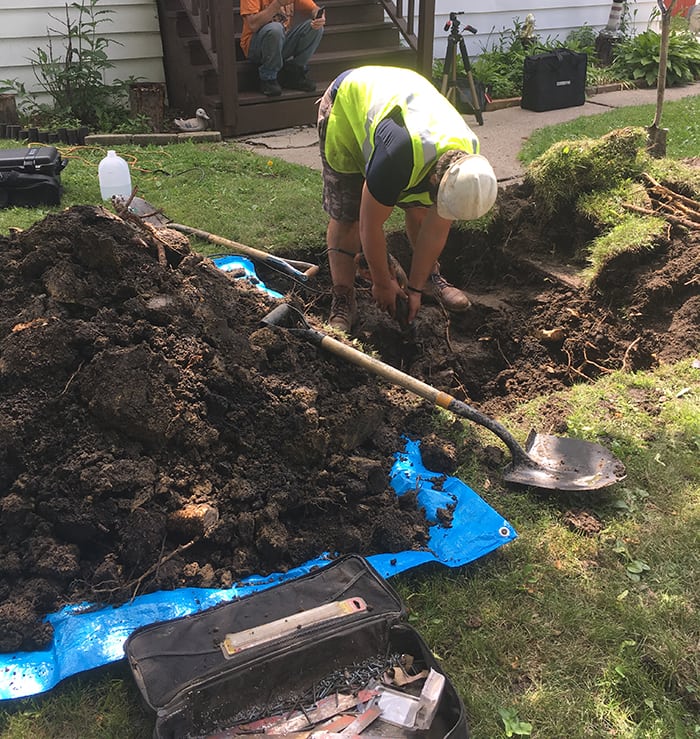 A HomeServe contractor works to repair Paul T.'s sewer line.