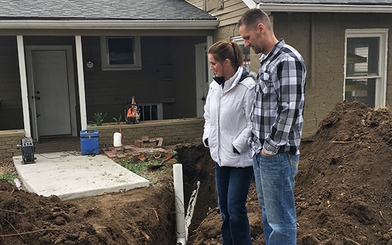 Wichita couple inspects their main sewer line repair project.